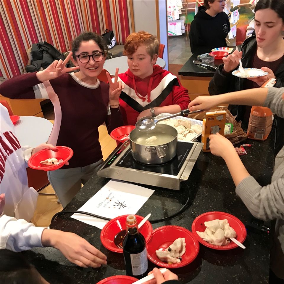Sarah with her classmates in Mr. Sundin's Chinese class, learning to make dumplings
