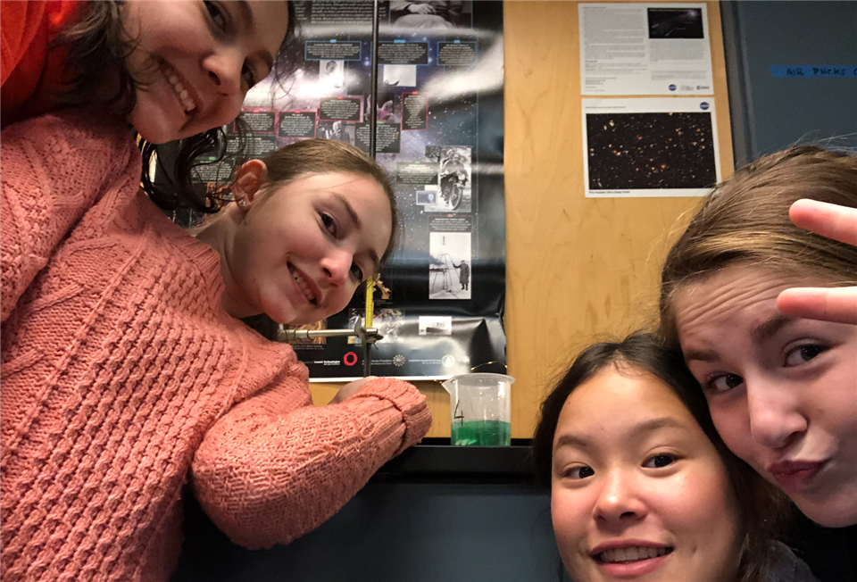 Meli and her classmates embracing scientific experimentation in their 9th grade sludge lab